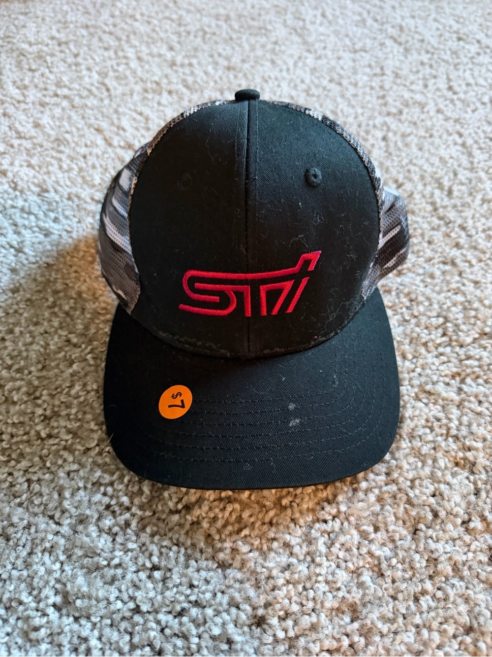 Embroidered Black Trucker Hat with Red Logo